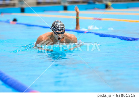 Athletic man swimming in Breaststroke style in the swimming pool. 63861518