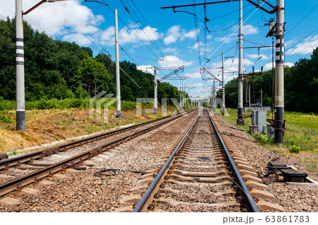 Scenic railroad in rural area and blue sky 63861783