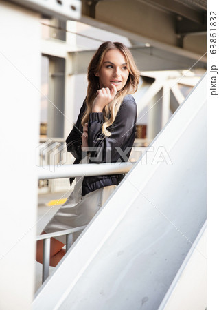 Beautiful blonde woman posing in the afternoon Beautiful blonde woman posing in the afternoon 63861832