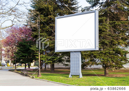 Blank billboard mockup with copy space in a pablic park on a spring day. Blank billboard mockup with copy space in a pablic park on a spring day. 63862666