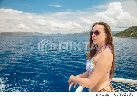Cute woman posing on a yacht Cute woman posing on a yacht 63862836