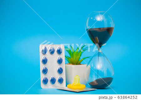 Pills for sexual male health on a blue background Pills for sexual male health on a blue background 63864252