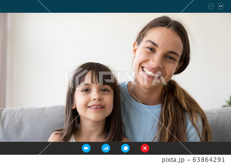 Headshot of smiling mom and little daughter have video call 63864291