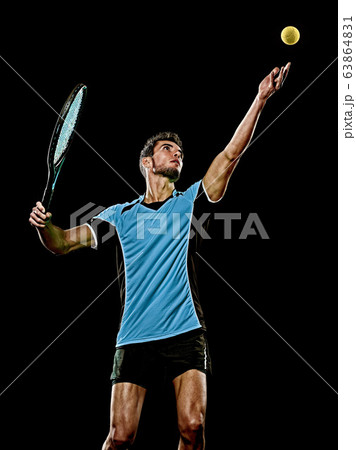 caucasian young tennis player man isolated black background caucasian young tennis player man isolated black background 63864831