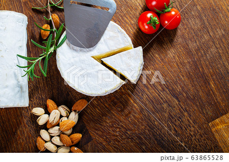 Camembert cheese or brie on wood background Camembert cheese or brie on wood background 63865528