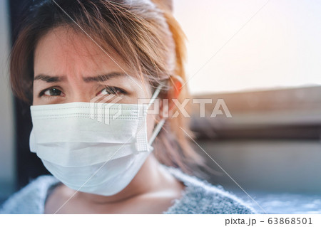 Sick asian woman have hight fever flu wear Sick asian woman have hight fever flu wear 63868501