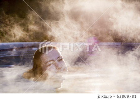 A teenage girl swimming in a pool 63869781