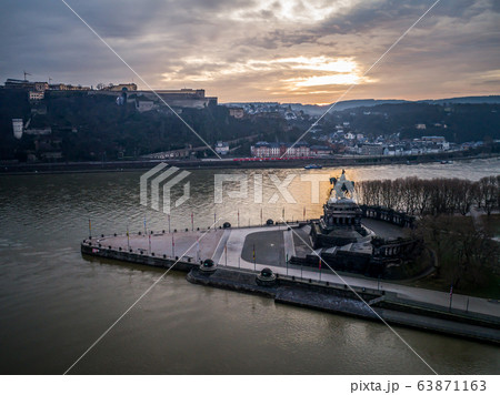 Colorful Sunrise burning sky Koblenz City historic monument German Corner where river rhine and mosele flow together Colorful Sunrise burning sky Koblenz City historic monument German Corner where river rhine and mosele flow together 63871163