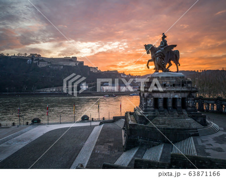 Colorful Sunrise burning sky Koblenz City historic monument German Corner where river rhine and mosele flow together Colorful Sunrise burning sky Koblenz City historic monument German Corner where river rhine and mosele flow together 63871166