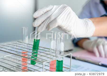 Scientist wear lab coat and protective wear are Scientist wear lab coat and protective wear are 63872979