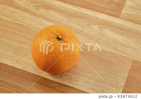 Fresh orange fruit on wooden table 63873612