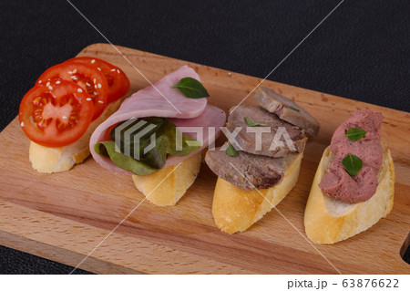 Bruschetta with tomato, ham and tongue 63876622