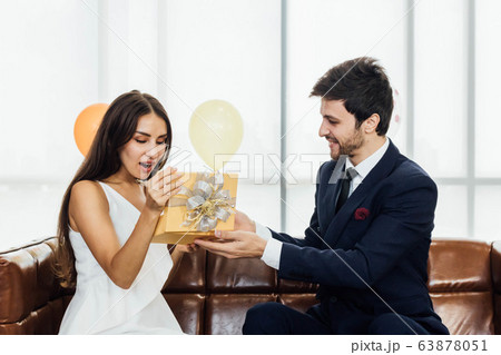 Young couple celebrating new year together, 63878051