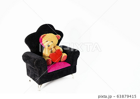 A teddy bear sitting on white background A teddy bear sitting on white background 63879415