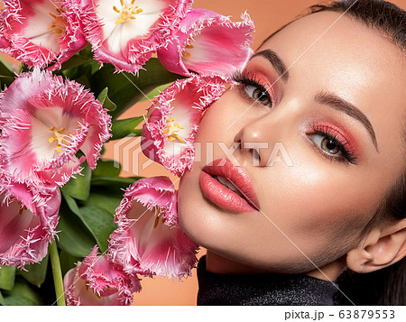 Beautiful white girl with flowers. Stunning 63879553