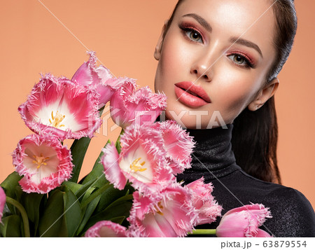 Beautiful white girl with flowers. Stunning 63879554