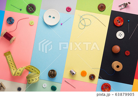 sewing tools and accessories at paper background 63879905