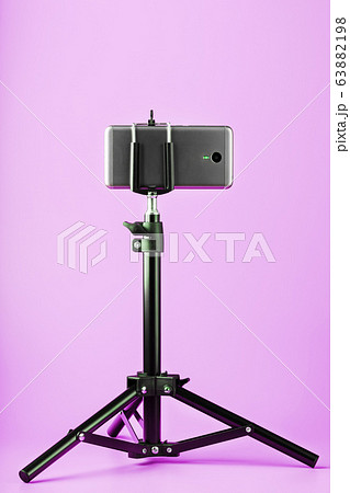 Smartphone on a tripod as a photo-video camera on Smartphone on a tripod as a photo-video camera on 63882198