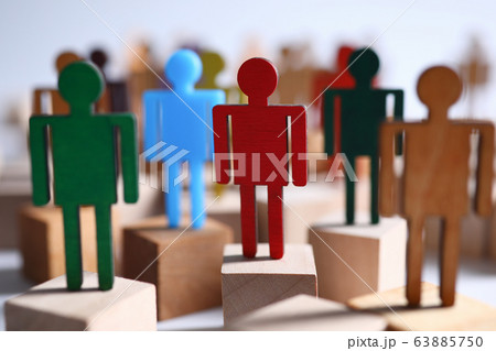 Colored wooden figures business men suits on bars Colored wooden figures business men suits on bars 63885750