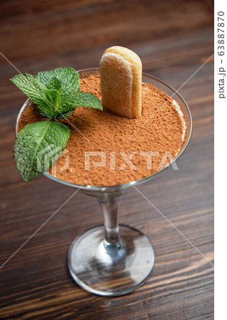 Tiramisu in a glass vase . catering menu 63887870