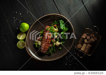 Grilled fish steak with broccoli and cauliflower. catering menu Grilled fish steak with broccoli and cauliflower. catering menu 63888320