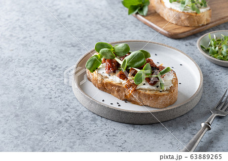 Sandwich on toast with fresh radish microgreens 63889265