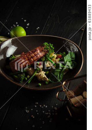 Grilled fish steak with broccoli and cauliflower. catering menu 63889433