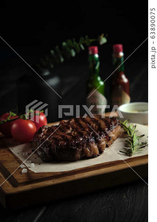 Meat steak on a wooden board. catering menu Meat steak on a wooden board. catering menu 63890075