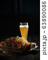 Glass of cold beer with appetizer. catering menu 63890086
