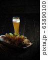 Glass of cold beer with appetizer. catering menu 63890100