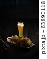 Glass of cold beer with appetizer. catering menu 63890118