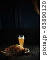 Glass of cold beer with appetizer. catering menu 63890120