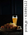 Glass of cold beer with appetizer. catering menu 63890122