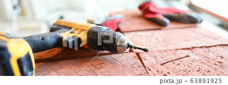 Screwdriver lies bricks, construction and repair 63891925