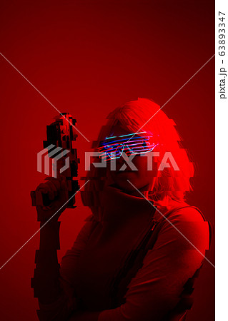 Girl with blaster in the futuristic battle. Concept virtual reality, cyber game. Image with glitch effect. 63893347