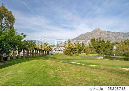 A golf course at the foot of the La Concha mountain in Spain A golf course at the foot of the La Concha mountain in Spain 63893713