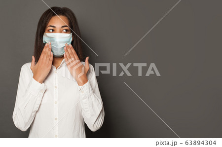 Black woman in face mask. Epidemic and virus 63894304