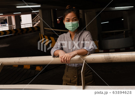 Young woman wearing protection face mask To prevent Virus infection, epidemics covid-19 and PM 2.5 Young woman wearing protection face mask To prevent Virus infection, epidemics covid-19 and PM 2.5 63894628