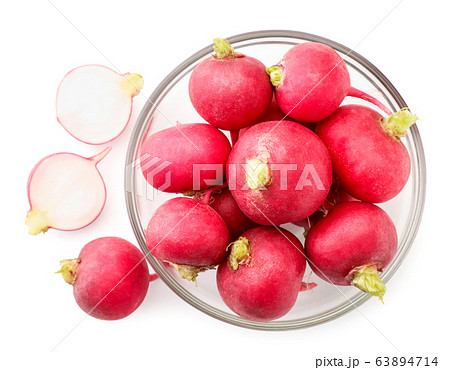 Radish in a glass plate and halves on a white. The 63894714