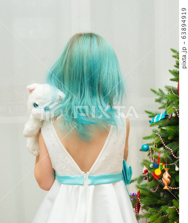 girl with blue hair in a white dress and a toy cat 63894919