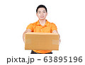 young delivery man holding box cardboard give the 63895196