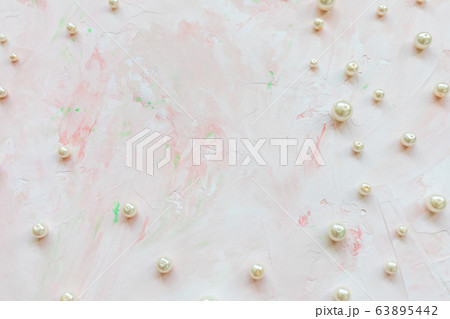 White pearls on pink. Creative abstract background White pearls on pink. Creative abstract background 63895442