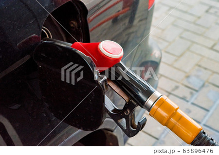 Refilling the car with fuel on a gas station 63896476