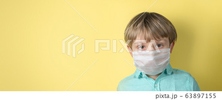Coronavirus cocept - boy wearing face mask Coronavirus cocept - boy wearing face mask 63897155