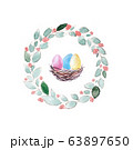 Colorful painted eggs in nest and spring wreath. 63897650