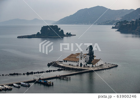 Monastery Vlacherna and the Mouse Island at clouds rainy weather, sea gulf, the airport runway is nearby, Kanoni, Corfu, Greece 63900246
