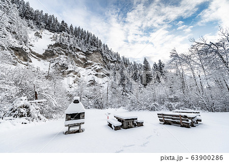 Recreation areas near the Landwasser Viaduct, famous place at winter, landmark of Switzerland, snowing, grill 63900286