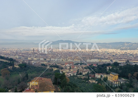 Aerial panorama of Florence at sunrise, Firenze, Tuscany, Italy, cathedral, river, drone pint view, mountains is on background 63900629