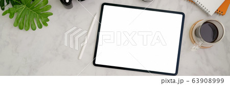 Overhead shot of trendy workspace with blank 63908999