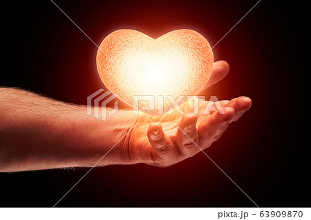 glow heart in hand glow heart in hand 63909870